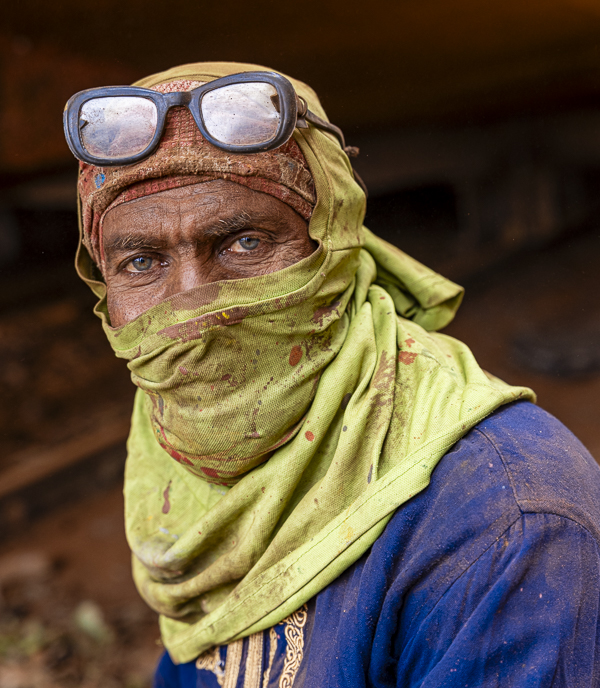 Bangladesh man with head covering, face covering and glasses