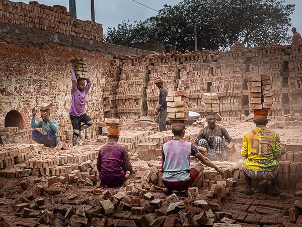 Bangladesh workers making and stacking bricks